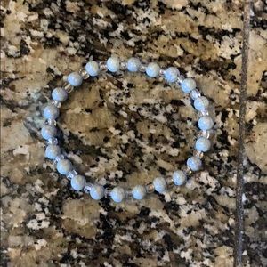 A light blue and white bracelet